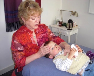 Judith Sullivan using CranioSacral Therapy, Zero Balancing and Visceral Manipulation to help a child heal.